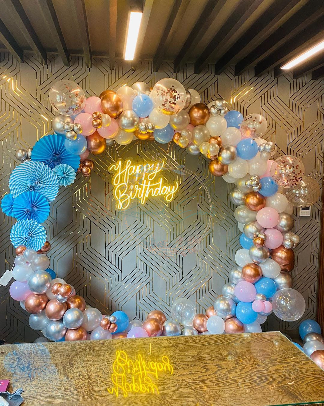Glittery Balloons and Unique Paper Fan Circle Decoration.