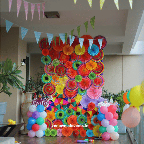 Festival of Colors: A Vibrant Holi Backdrop with Multicolor Fans, Bunting, and Holi Cutouts