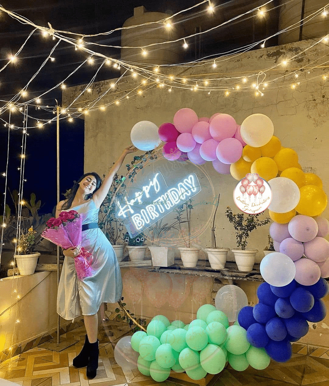 Pastel balloon decor with Neon Happy Birthday