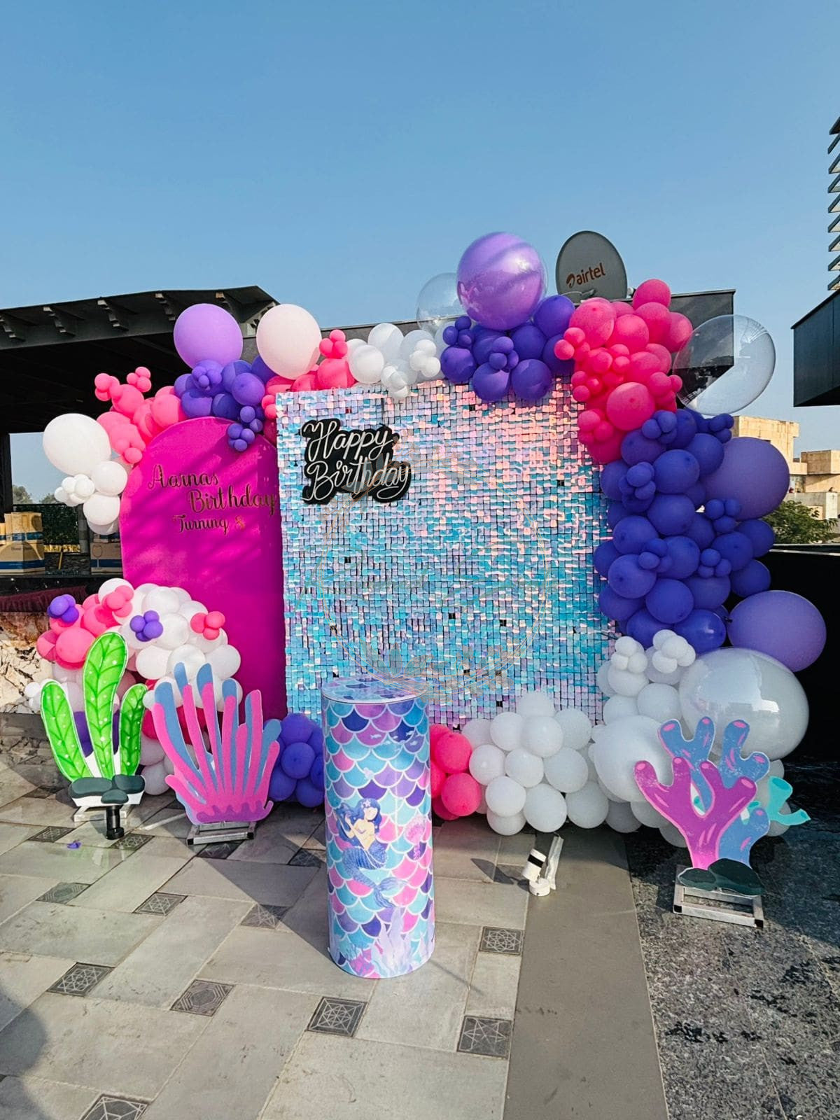 A vibrant and playful birthday party setup with a mermaid theme.
