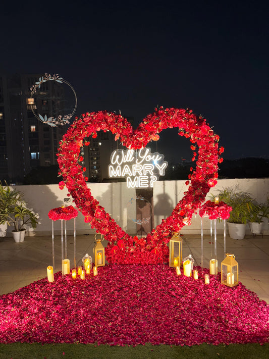 Luxury Surprise Proposal Setup with Heart Floral Arch, Candles & Romantic Decor