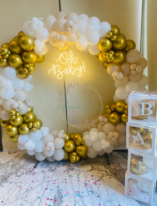 stylish and memorable baby shower with baby boxes and a neon light
