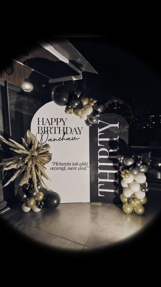 Premium rooftop birthday decoration with black gold theme and lights