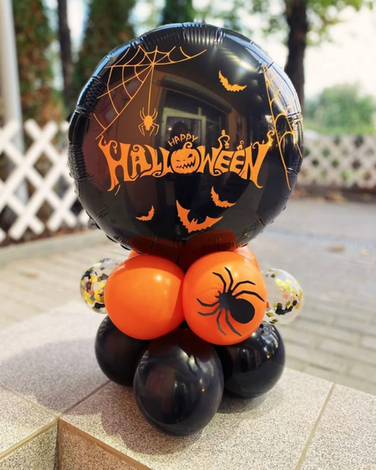 Black and orange Halloween balloon decoration with spider print and Happy Halloween foil balloon centerpiece.
