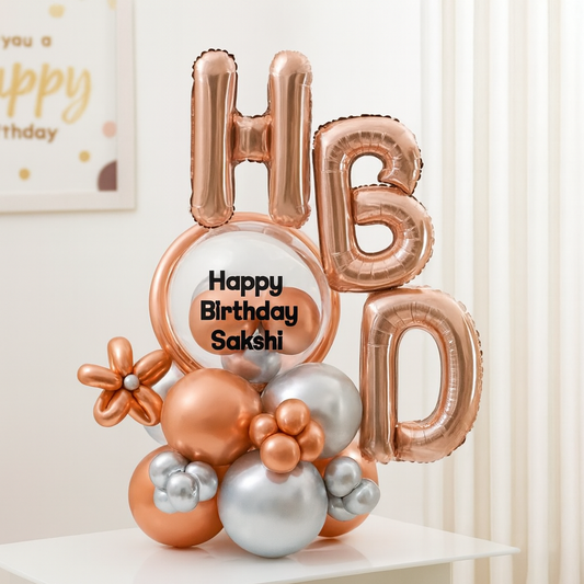 Happy Birthday balloon bouquet with custom name sticker on transparent balloon in rose gold and silver theme