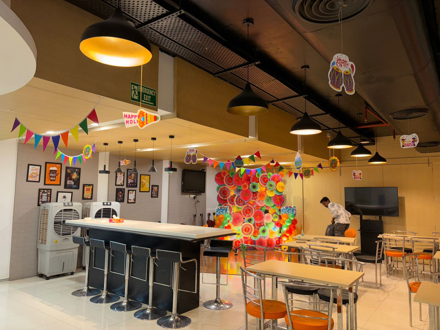 Vibrant Paper Fan Holi Backdrop with Balloon Pillars – Festive Photo Booth Decor