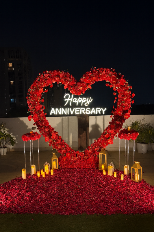 Romantic Happy Anniversary Rooftop Decoration with Heart Floral Arch & Candlelight Setup
